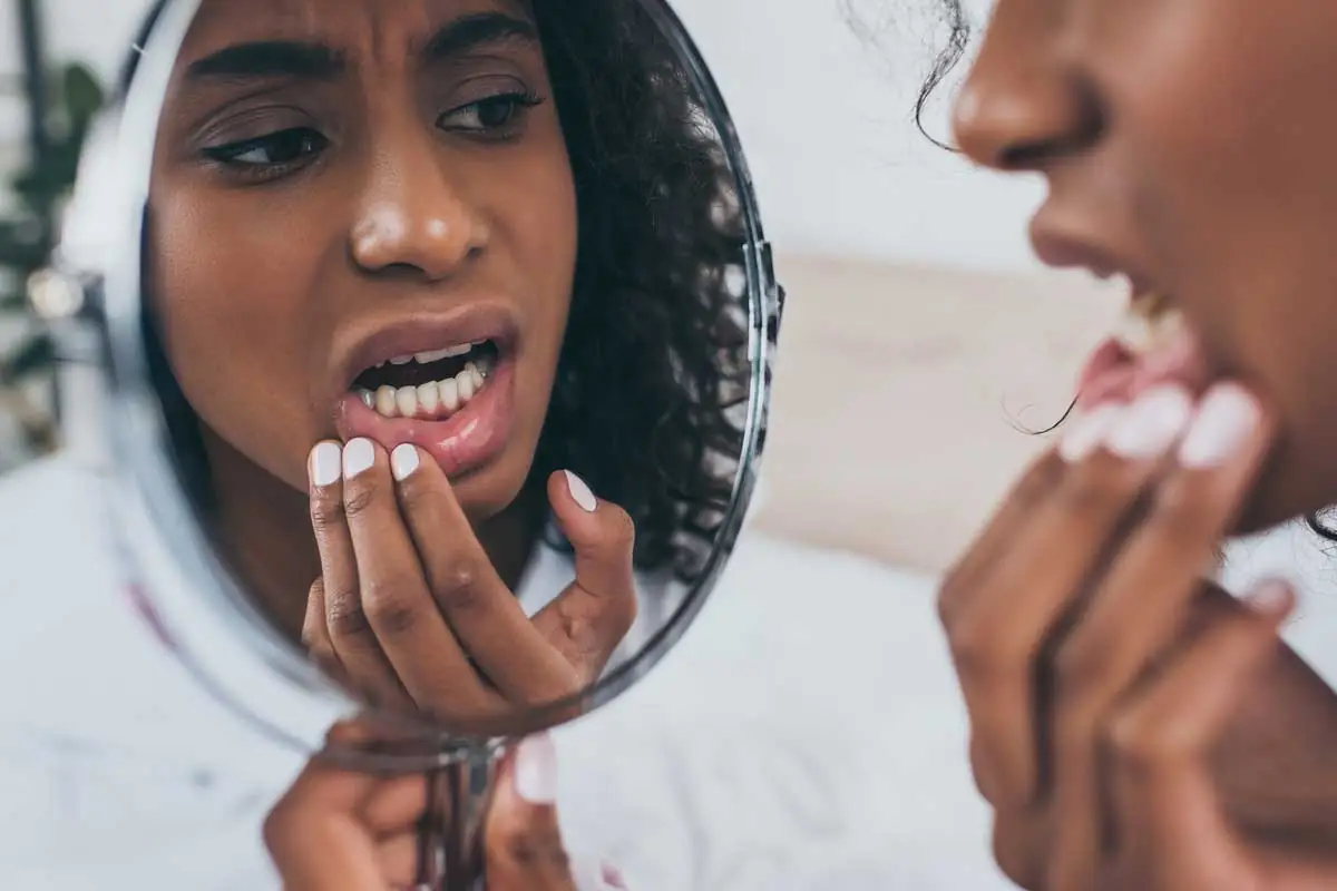 woman needing emergency dental care in Tulsa, OK
