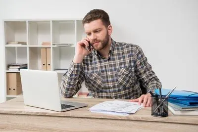 man scheduling a dental appointment at Contemporary Dental Arts