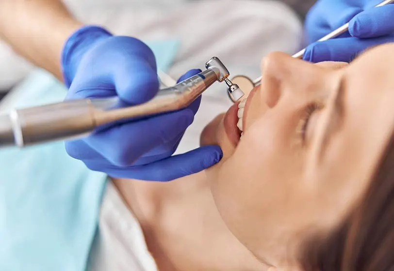 patient getting teeth cleaned at Contemporary Dental Arts in Tulsa, OK