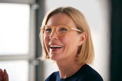 woman loving her dental implants from Contemporary Dental Arts