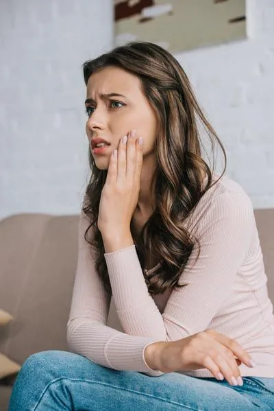 woman needing emergency dental care in Tulsa, OK