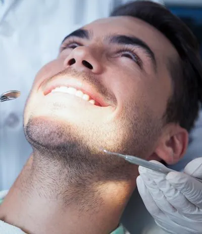 man getting his teeth cleaned at Contemporary Dental Arts