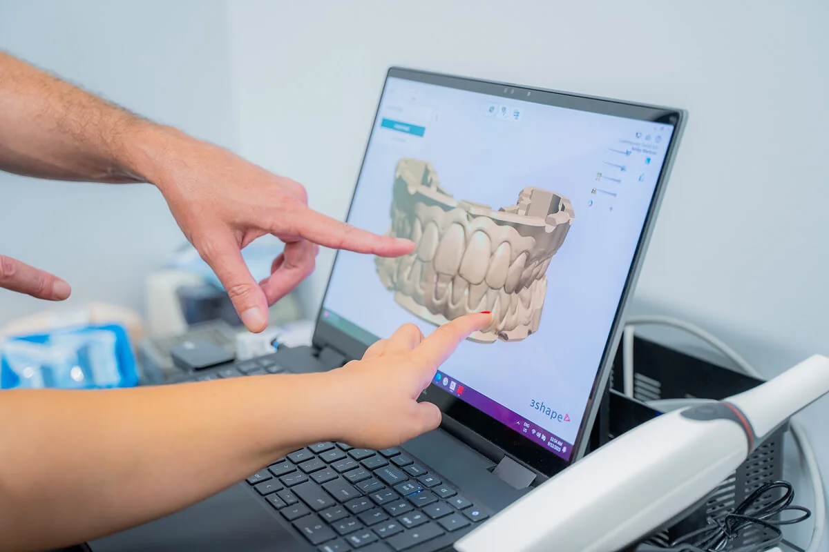 A male patient checking in at the front desk of Tulsa Family Dental in Tulsa OK for an emergency dentist appointment.