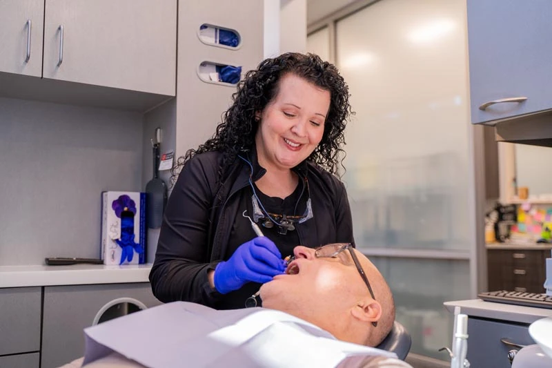 Friendly staff at Contemporary Dental Arts in Tulsa OK during a dental cleaning.