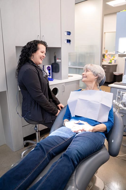 Patient in the exam chair speaking with the staff at Contemporary Dental Arts in Tulsa OK.