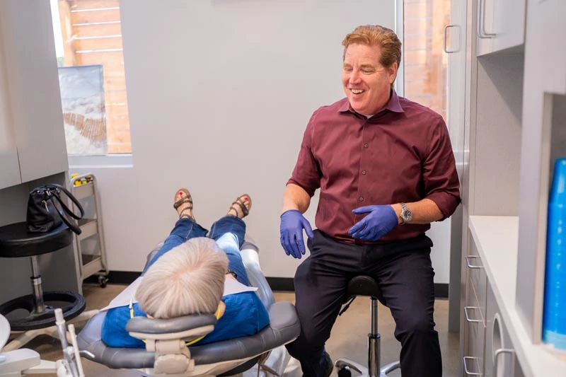 Patient in the exam chair speaking with the staff at Contemporary Dental Arts in Tulsa OK.